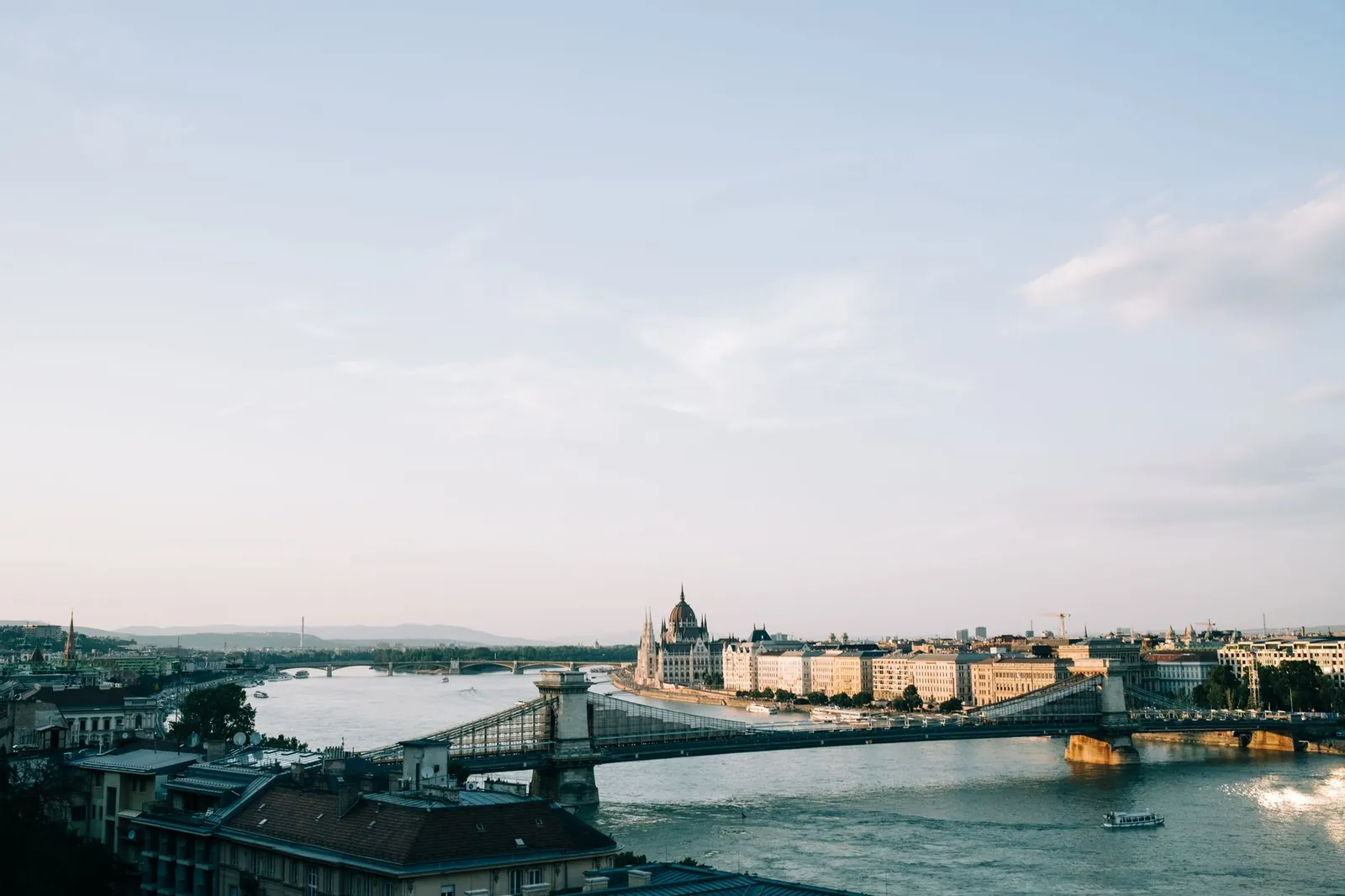 Panoramic view of the Danube, the Chain Bridge and the Budapest skyline at dusk